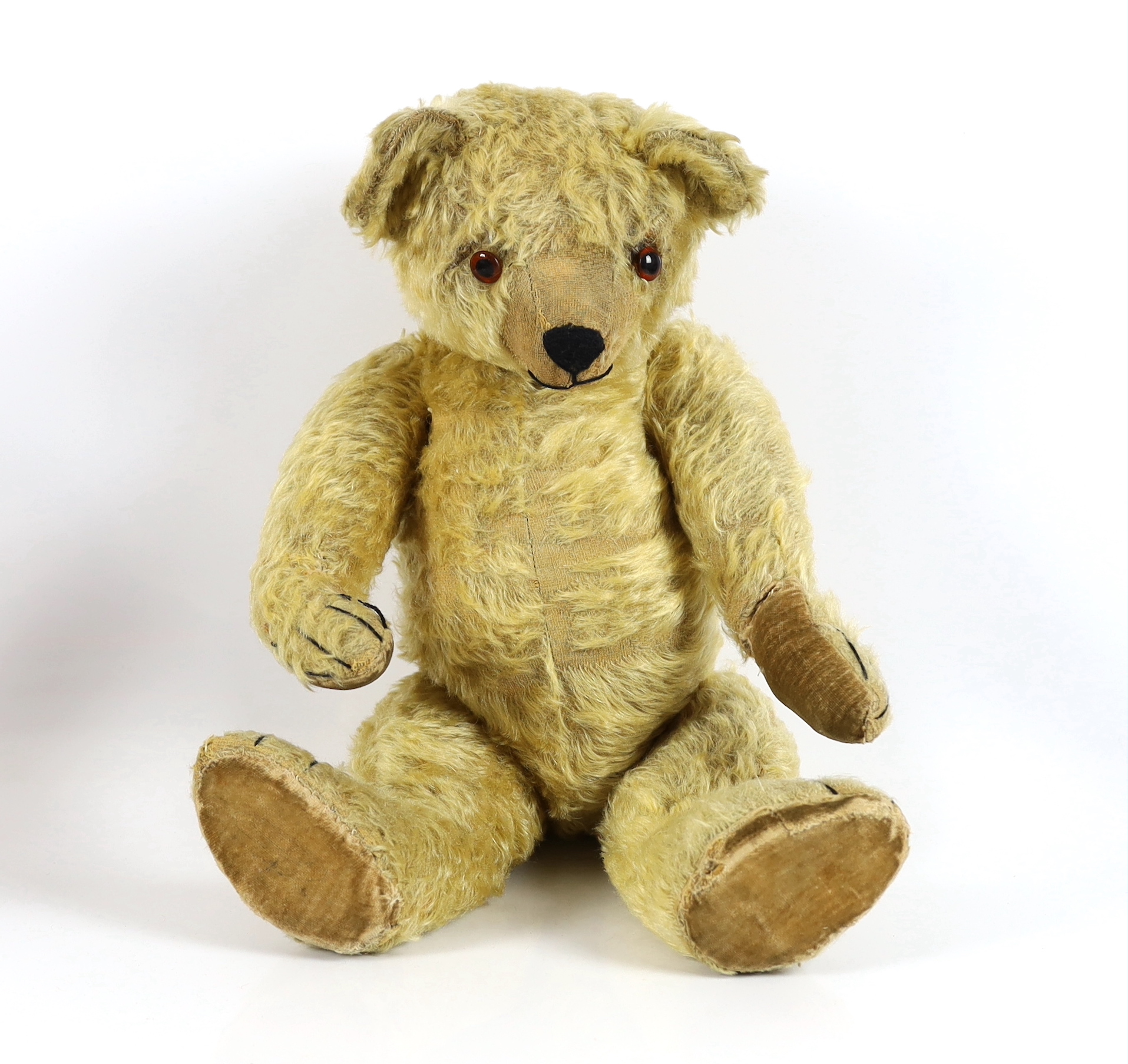 A large 1930's Chiltern bear, 53cm, with replaced nose stitching, some hair loss generally